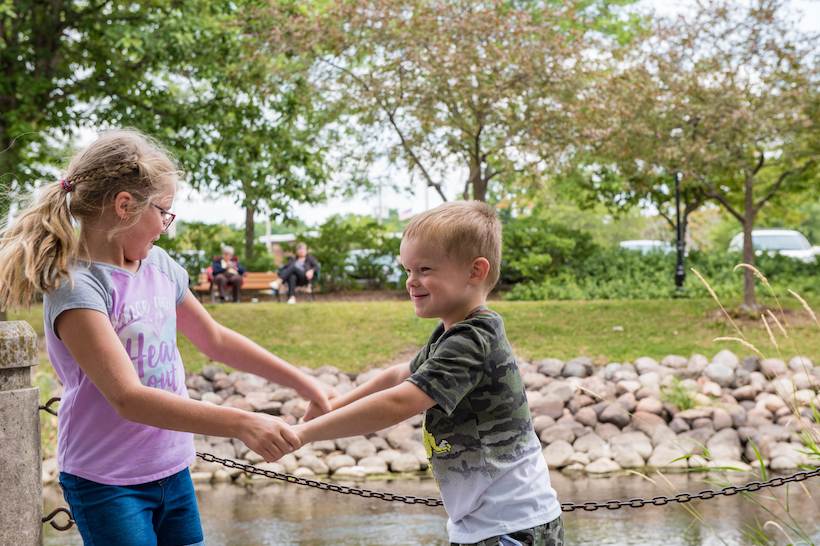 Two kids dancing in downtown waukesha