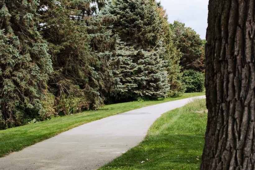 A walking path in a waukesha park.
