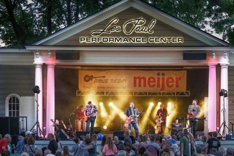 A band performing on the les paul performance center stage.